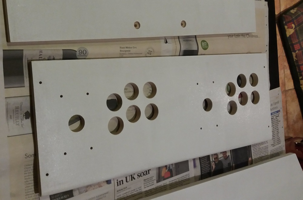 The arcade control panels drilled and primed